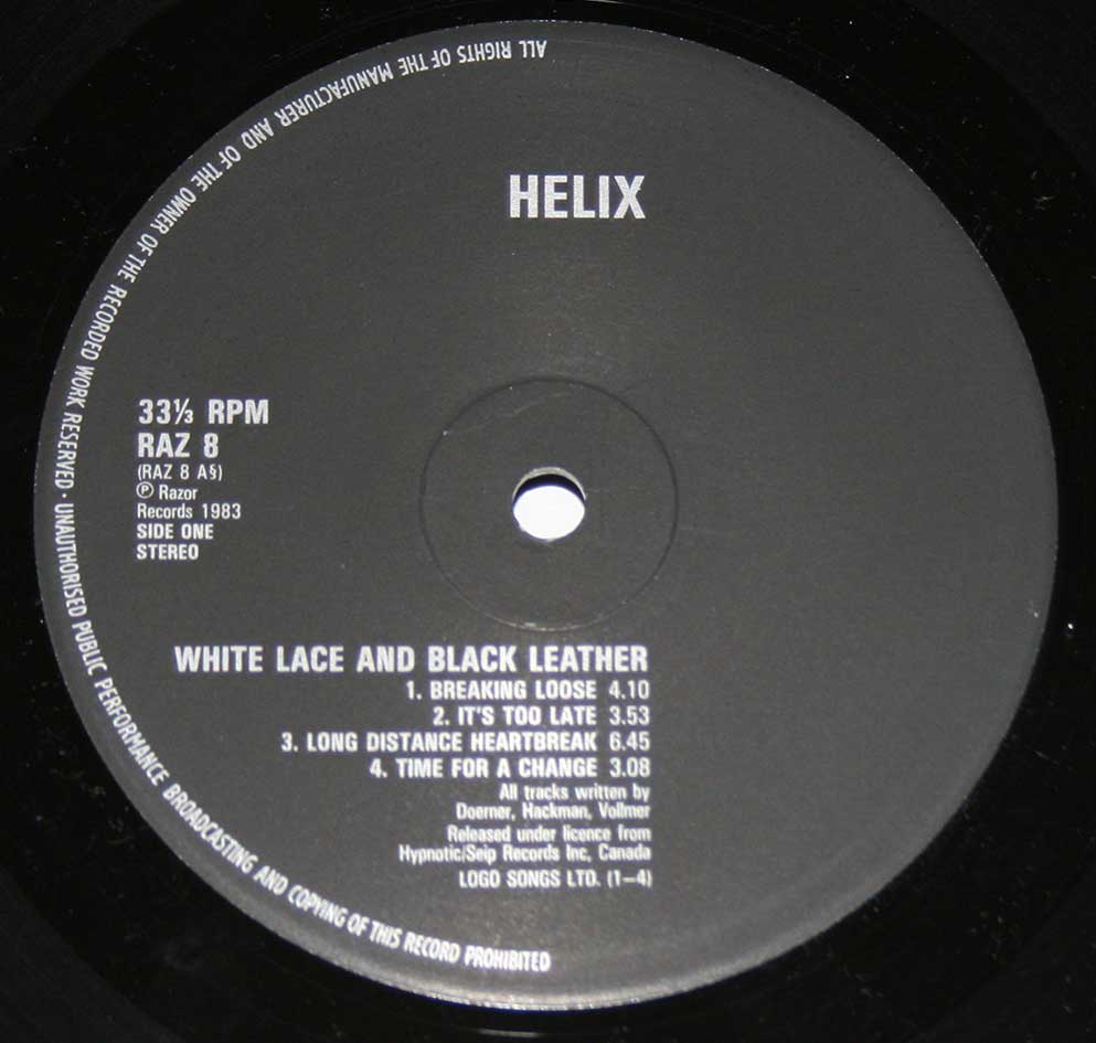Close-up Photo of the black "Razor Records" RAZ 8 Record label for "HELIX - White Lace & Black Leather" 