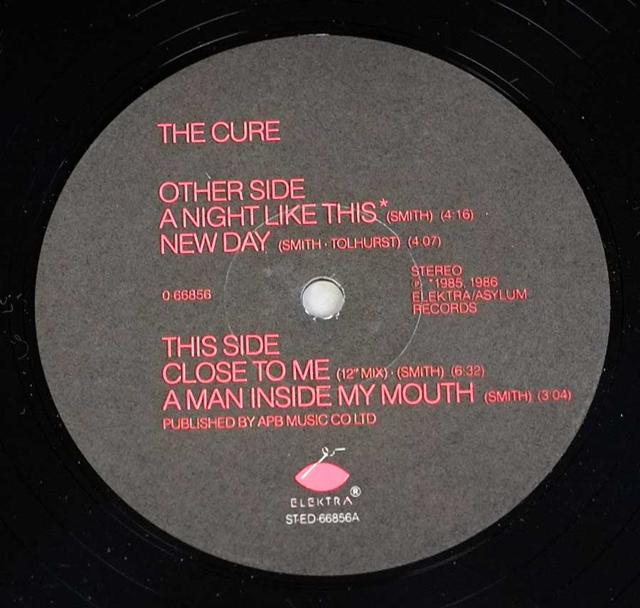 Close up of record's label THE CURE - Quadpus 12" LP Vinyl Album Side One