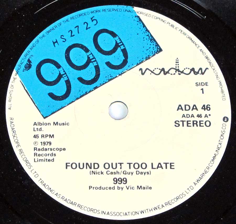 Close up of Side One record's label 999 - Found Out Too Late,  Lie Lie Lie 7" 45rpm ps single vinyl
