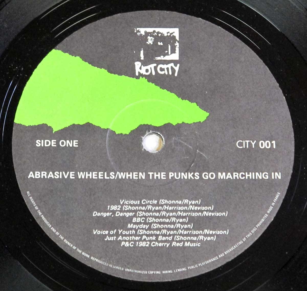 Enlarged High Resolution Photo of the Record's label ABRASIVE WHEELS - When The Punks Go Marching In https://vinyl-records.nl