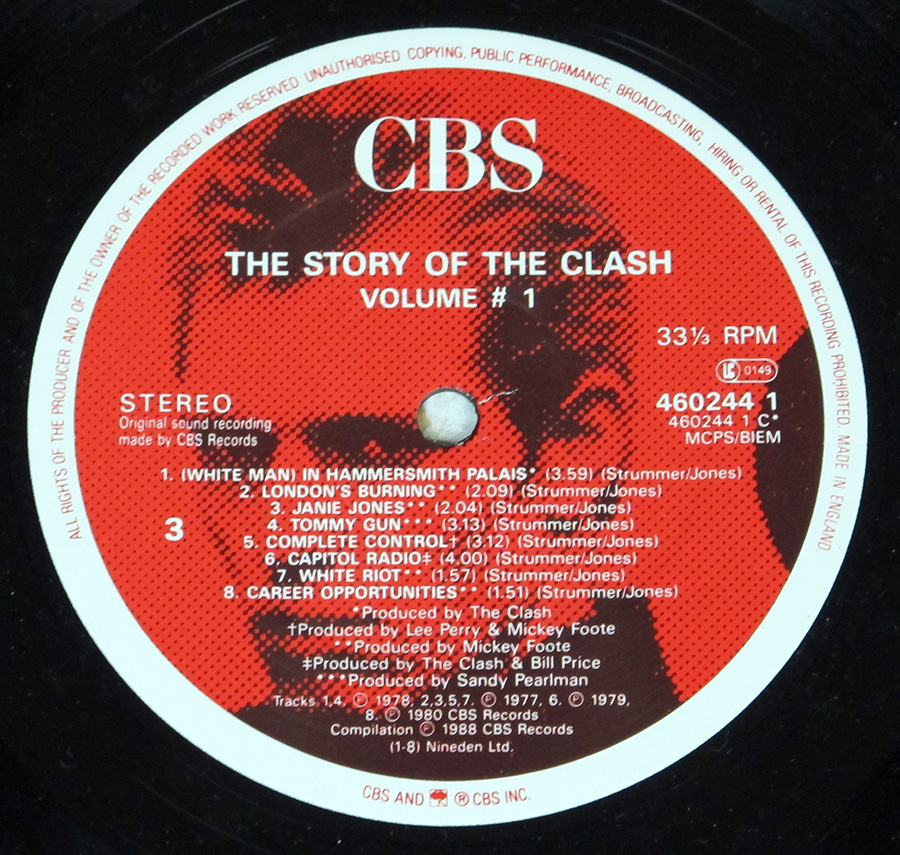 Close up of record's label THE CLASH - Story Of The Clash Volume 1 12" Vinyl LP Album Side One