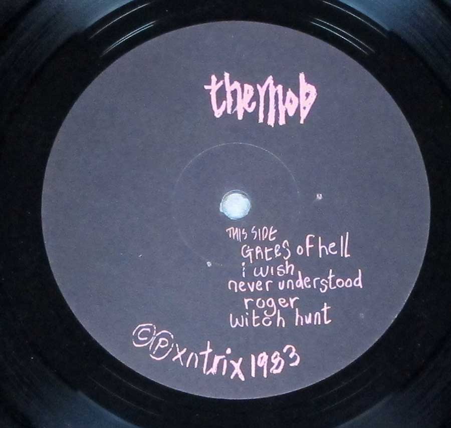 Close up of record's label MOB - Let the Tribe Increase Side One