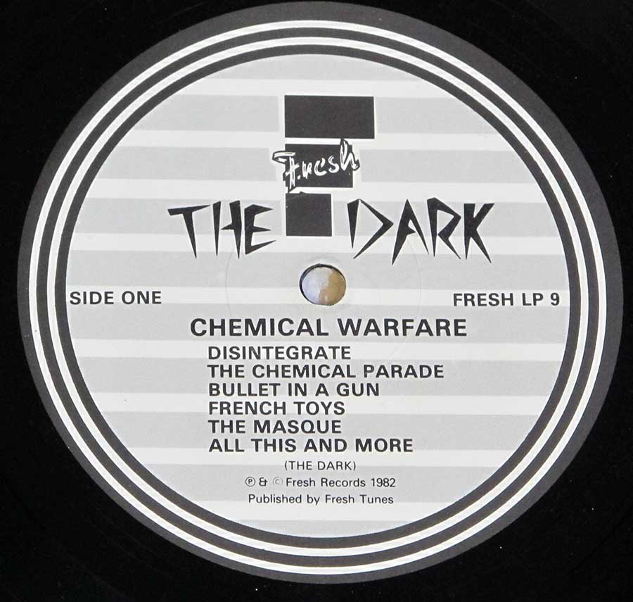 Close up of record's label THE DARK - Chemical Warfare + LYRICS SHEET FRESH 12" LP Vinyl Album Side One