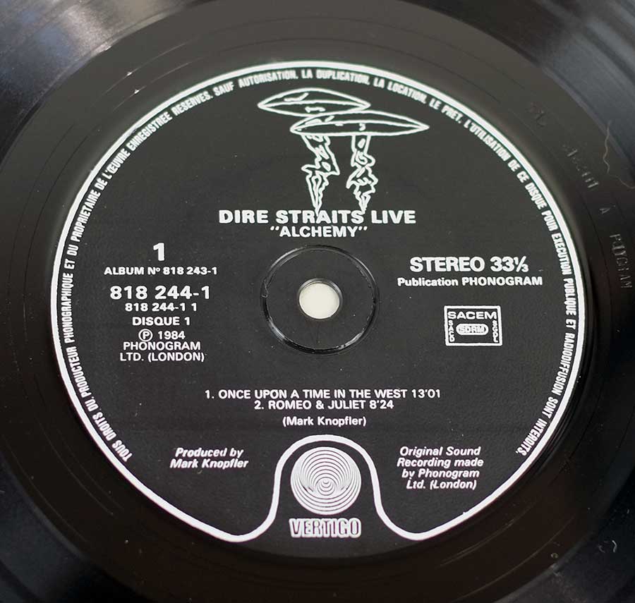 "Alchemy Live" Record Label Details: Black Colour with UFO Vertigo 818 244-1 ℗ 1984 Phonogram Ltd Sound Copyright 