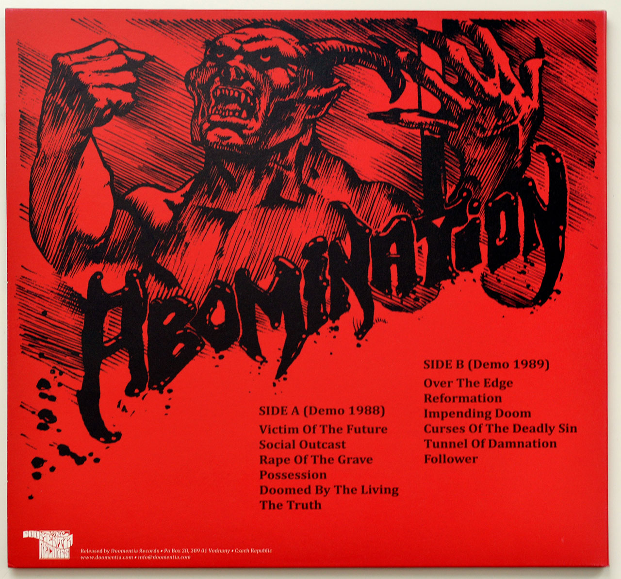 High Resolution Photo Album Back Cover of ABOMINATION Demos https://vinyl-records.nl