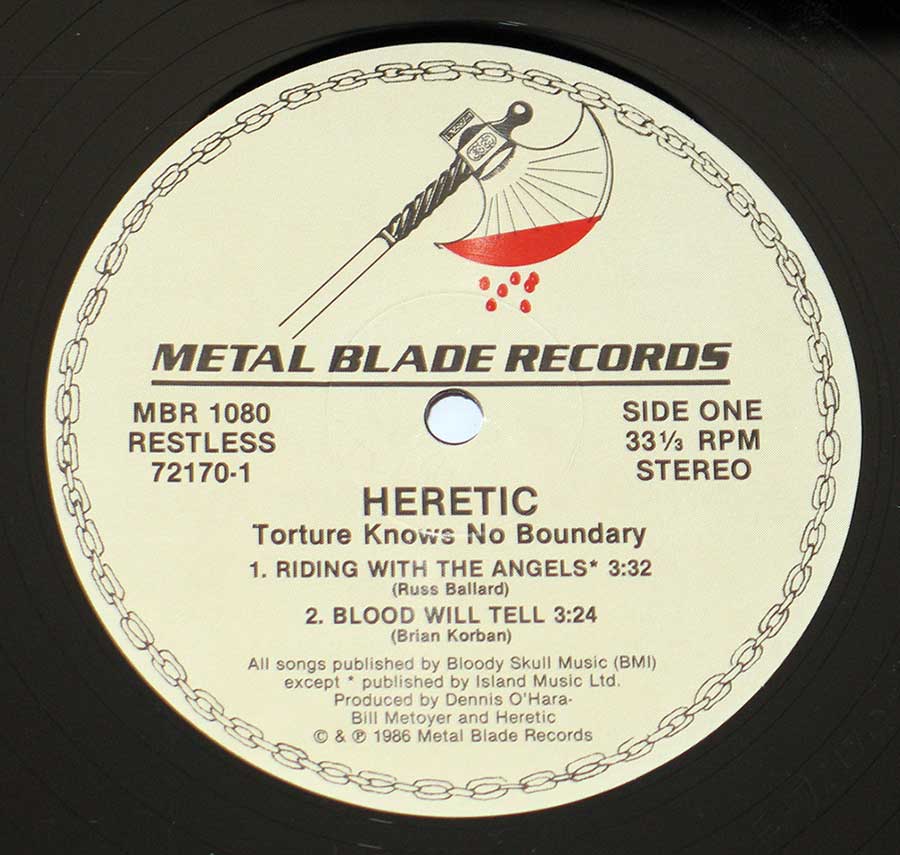 Close up of record's label HERETIC TORTURE - Knows No Boundary 12" Vinyl LP Album Side One