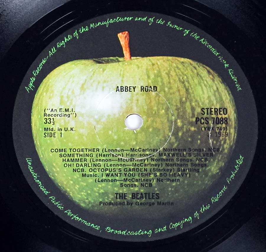 Close-up Photo of "BEATLES - Abbey Road Original UK misaligned Apple PC 7088" Record Label 