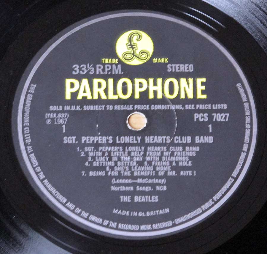 Close up of record's label THE BEATLES - Sgt Pepper's Lonely Hearts Club Band original UK GB PCS 7027  Side One