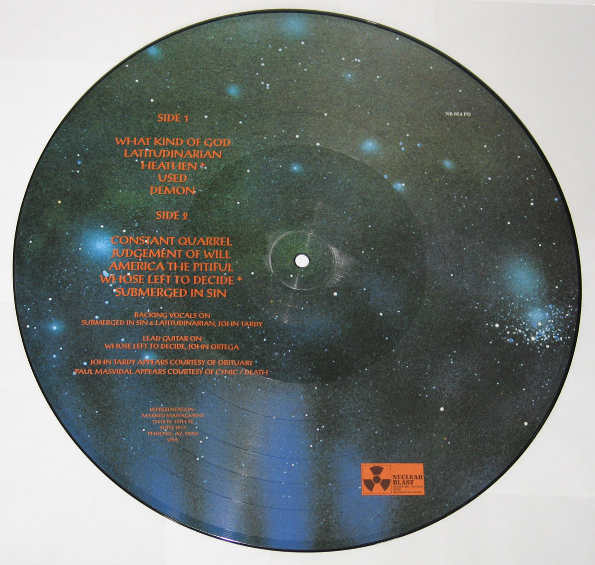 Picture disc vinyl of Master’s album 'On the Seventh Day God Created... Master', showing the back design. The record features a cosmic starfield background with track listing text printed in red serif letters. Side 1 includes five songs, Side 2 lists another five. Additional credits note guest musicians John Tardy from Obituary and Paul Masvidal from Cynic/Death. The Nuclear Blast Records logo appears at the lower right in orange. Catalog number NB 054 PD is printed at the top right.