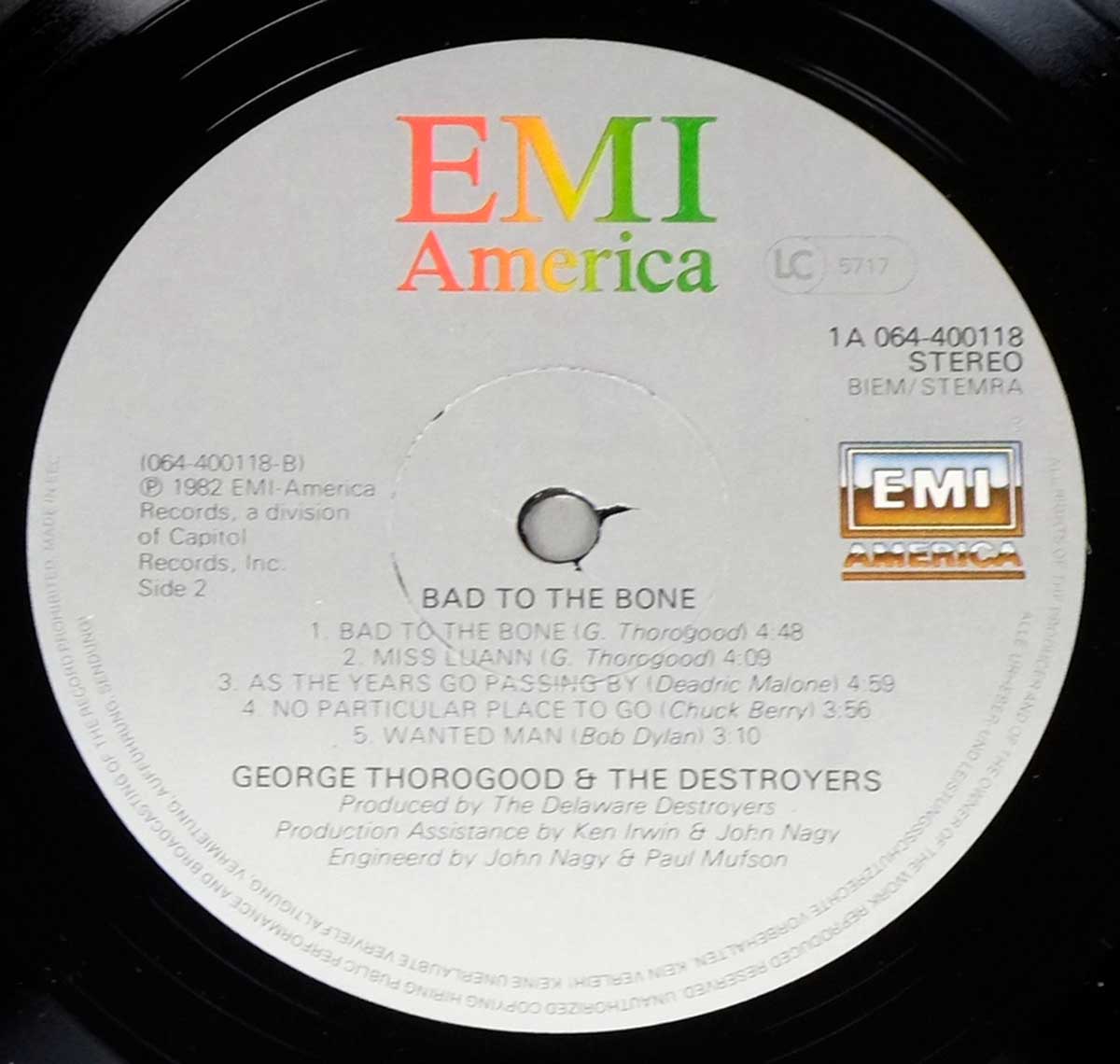 Side Two label of George Thorogood & The Destroyers’ 1982 LP 'Bad to the Bone' on EMI America, showing track list, catalog number 1A 064-400118, song credits, and the colorful EMI America logo with production details below the spindle hole.