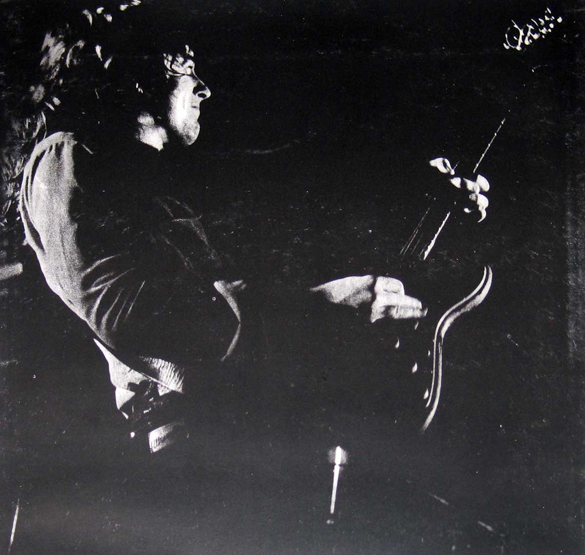 Photo of Rory Gallagher and his band performing live 