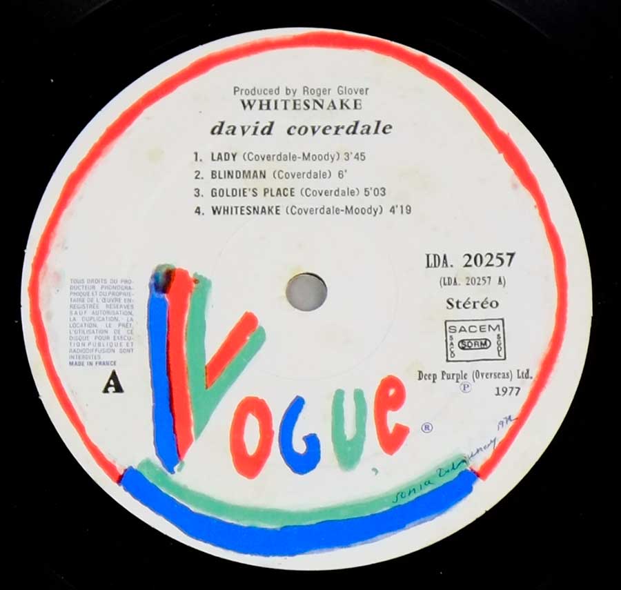 Close up of record's label DAVID COVERDALE - Whitesnake 12" LP Vinyl Album Side One