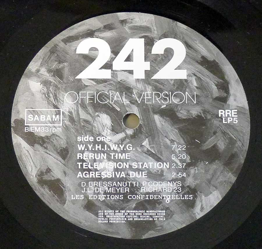 Close up of record's label FRONT 242 - OFFICIAL VERSION 12" LP VINYL Side One
