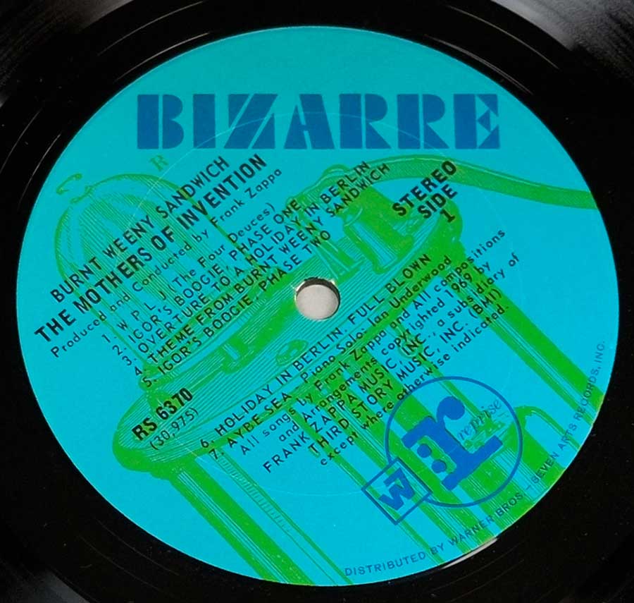 Close up of record's label MOTHERS OF INVENTION BURNT WEENY SANDWICH USA RS 6370 BLUE BIZARRE FOC Side One