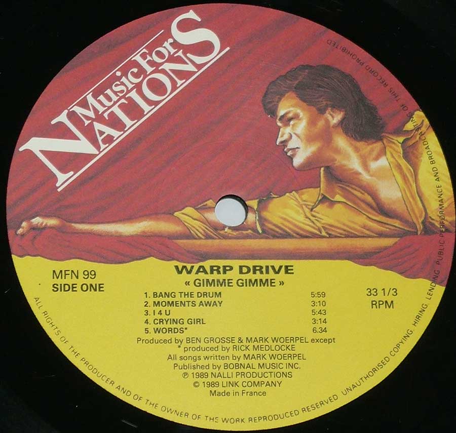 Close up of record's label WARP DRIVE - Gimme Gimme Side One