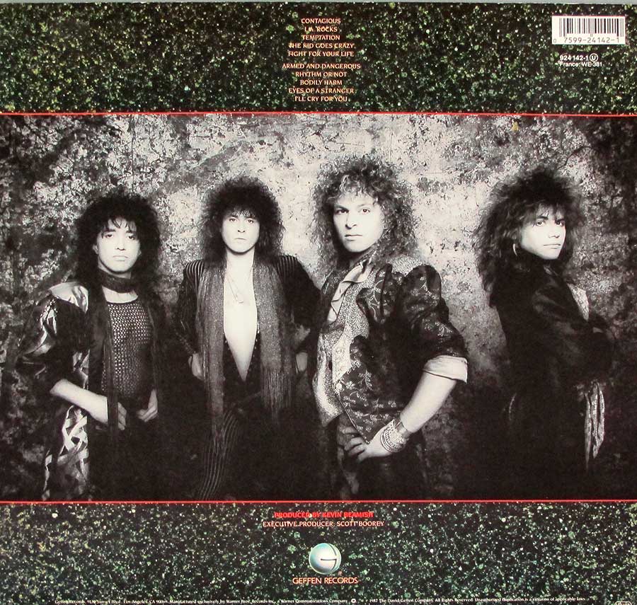 A group-phooto of the Y&T band printed on the album back over of Contagious