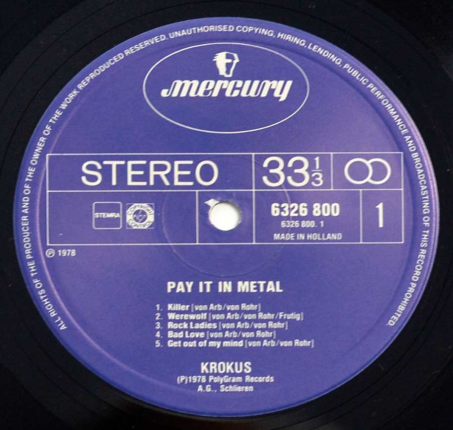 "Pay It In Metal by Krokus" Blue Colour Mercury Record Label Details: Mercury – 6326 800, Made in Holland ℗ 1978 PolyGram Records Sound Copyright 