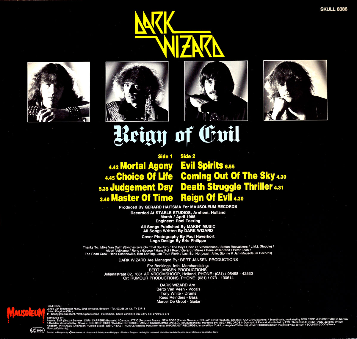 Back cover of Dark Wizard's 1985 album Reign of Evil on Mausoleum Records. The layout is black with the Dark Wizard logo in yellow at the top. Below are four monochrome band portraits arranged horizontally. The album title Reign of Evil is centered in gothic type. Left and right columns list tracks for Side 1 and Side 2 with timings. Lower half contains production credits, acknowledgments, booking info, and the band member lineup. Mausoleum Records logo is printed in red at the bottom left.