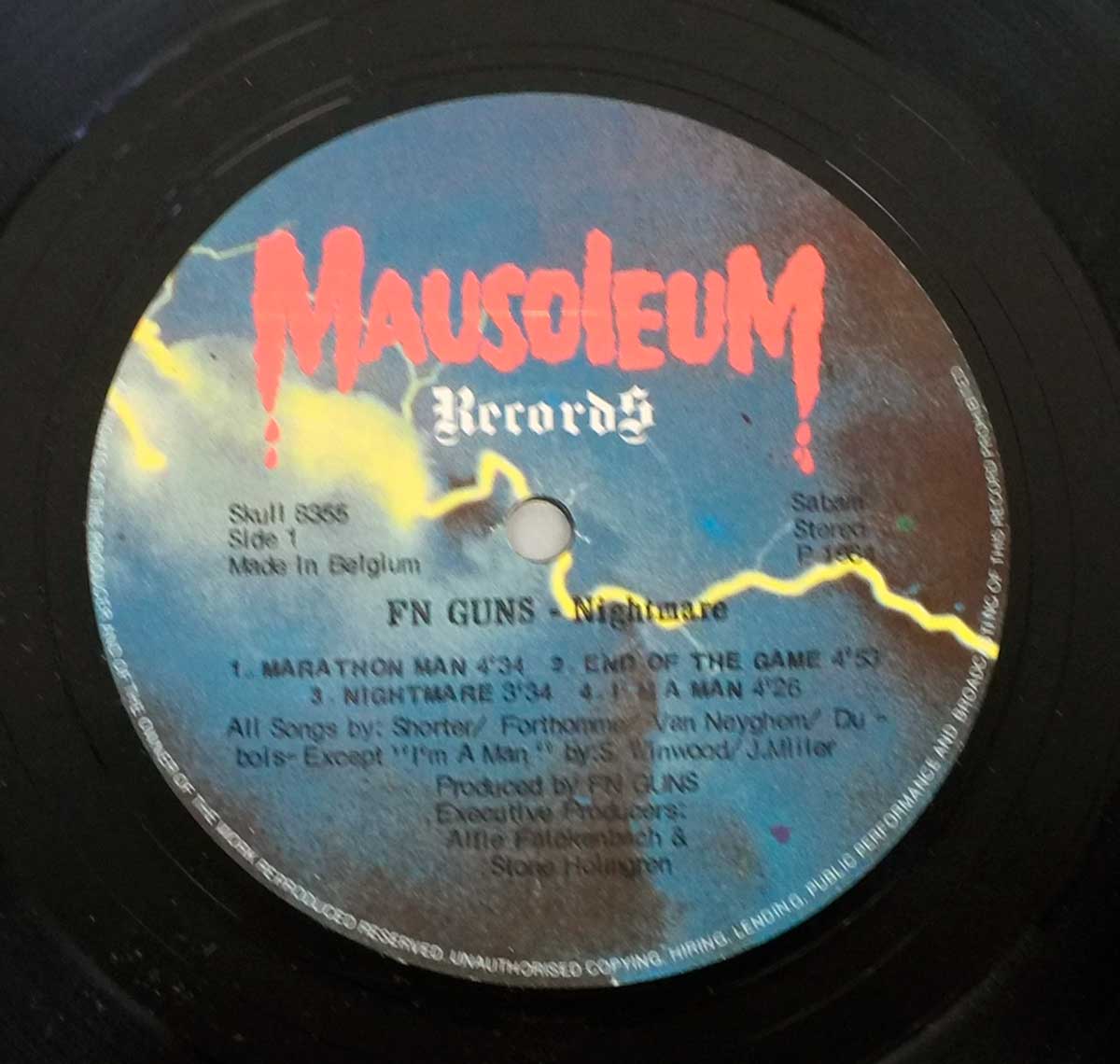 FN GUNS – Nightmare Side One label featuring Mausoleum Records logo, tracklist, production credits, catalog number Skull 8355, and lightning bolt design on a blue-black gradient background
