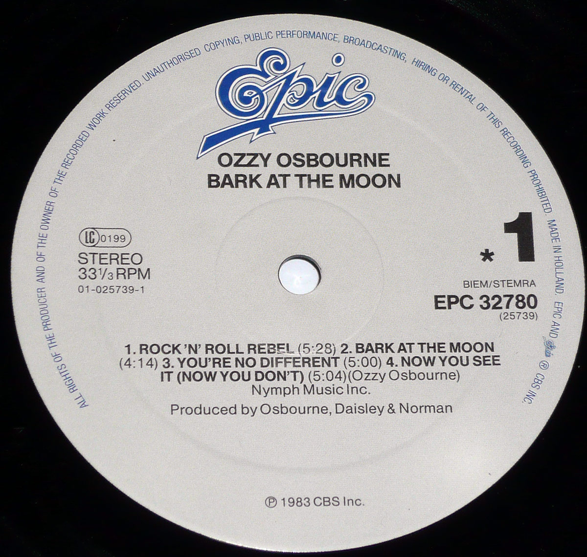 Side 1 Epic Records label of Ozzy Osbourne's Bark at the Moon with tracklist, catalog number EPC 32780, and production credits printed on a light grey label.