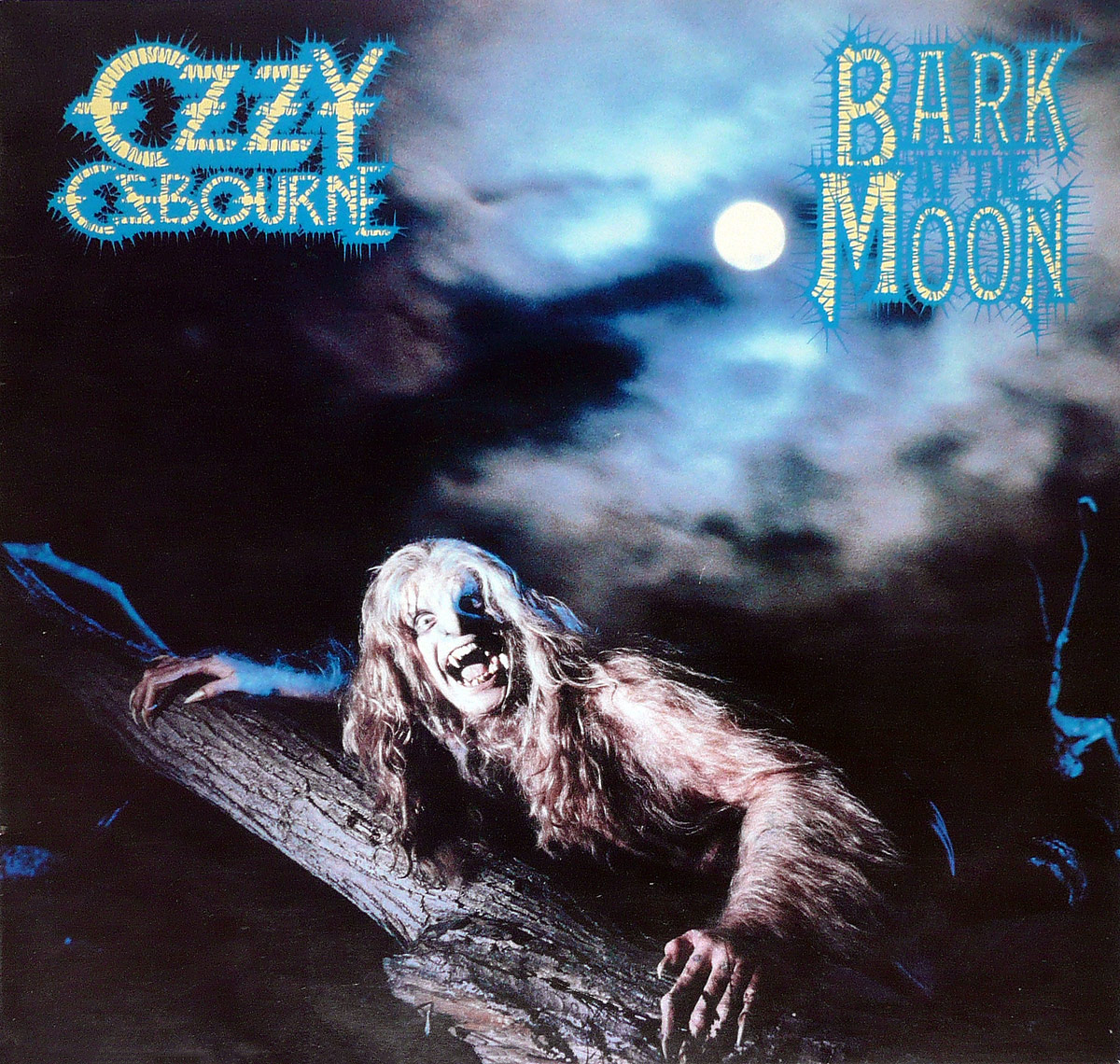 Ozzy Osbourne depicted as a werewolf-like creature crawling on a gnarled tree under a glowing full moon, with his name and the album title 'Bark at the Moon' in jagged neon blue lettering against a cloudy night sky.