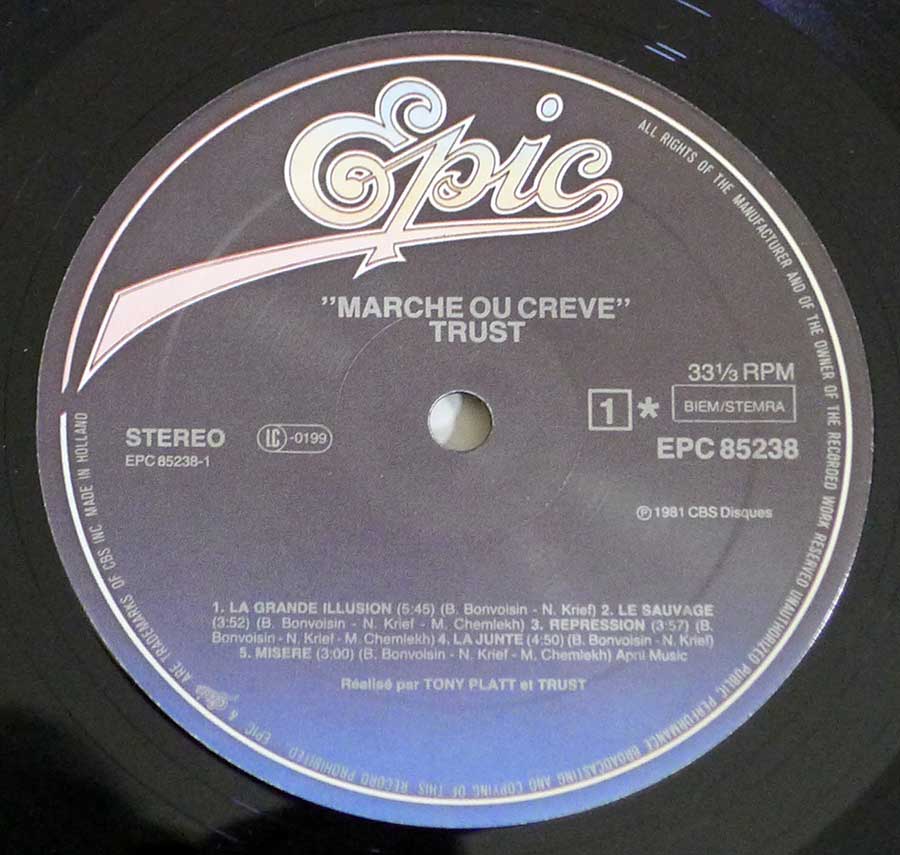 Close-up Photo of "TRUST Marche ou Creve" Record Label 