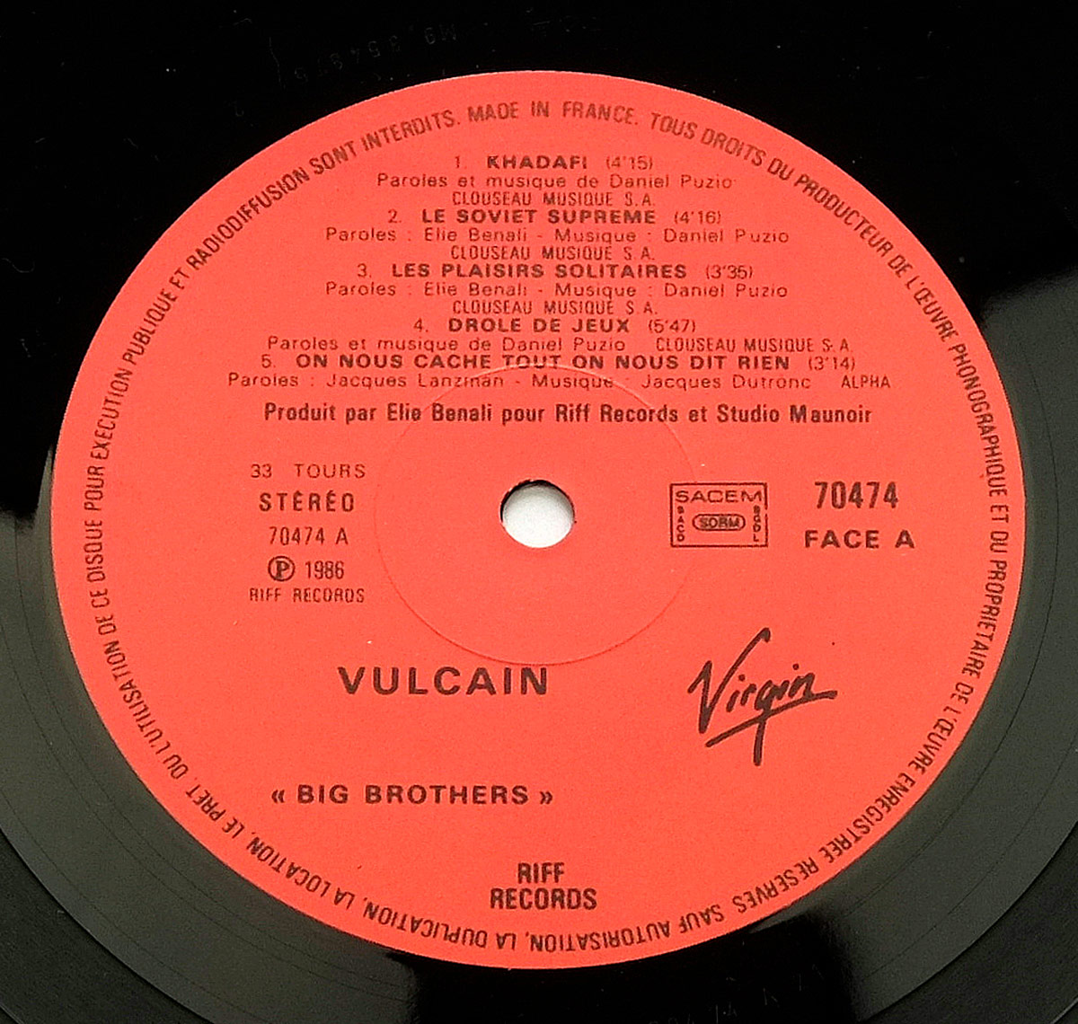 Close-up of Side A label on Vulcain's Big Brothers LP with tracklist for side one, Riff Records and Virgin logos, catalog number 70474, and SACEM rights notice.