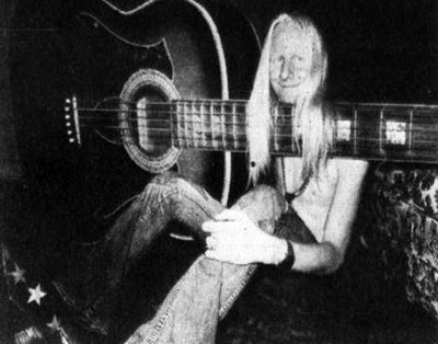 Photo of Johnny Winter's 108 inches, Photos holding oversized guitar 