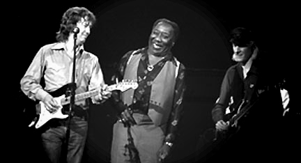 Photo of Eric Clapton, Muddy Waters, Johnny Winter performing together 