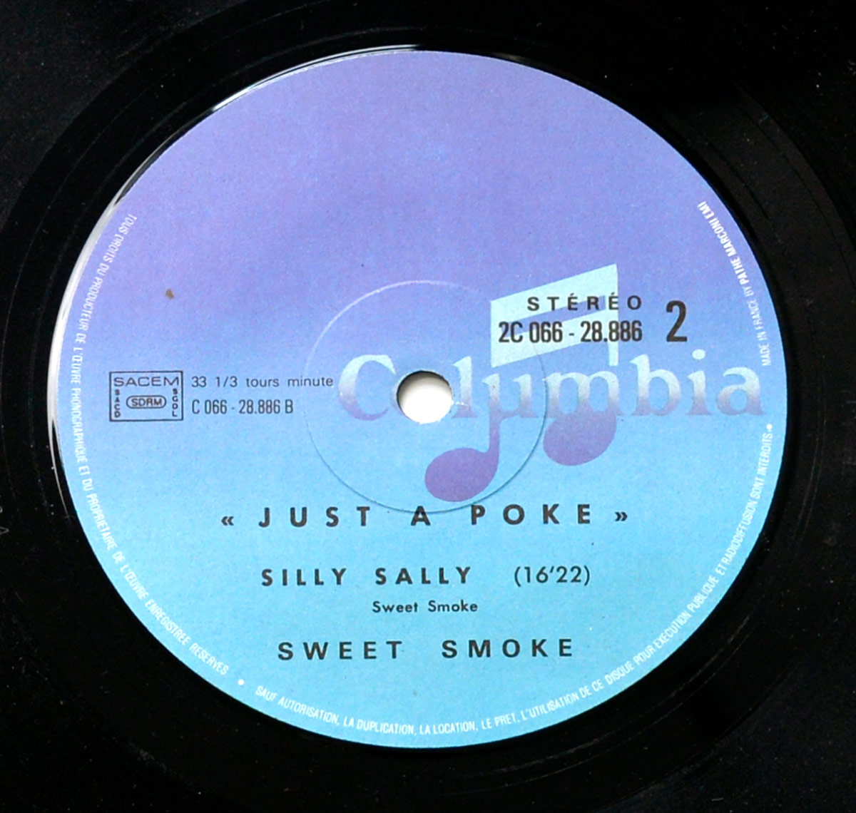 Close-up of Side Two label of French vinyl SWEET SMOKE - Just a Poke, Columbia 2C 066-28.886, featuring track Silly Sally, 33 1/3 RPM, purple-blue gradient, stereo, SACEM logo, made in France.