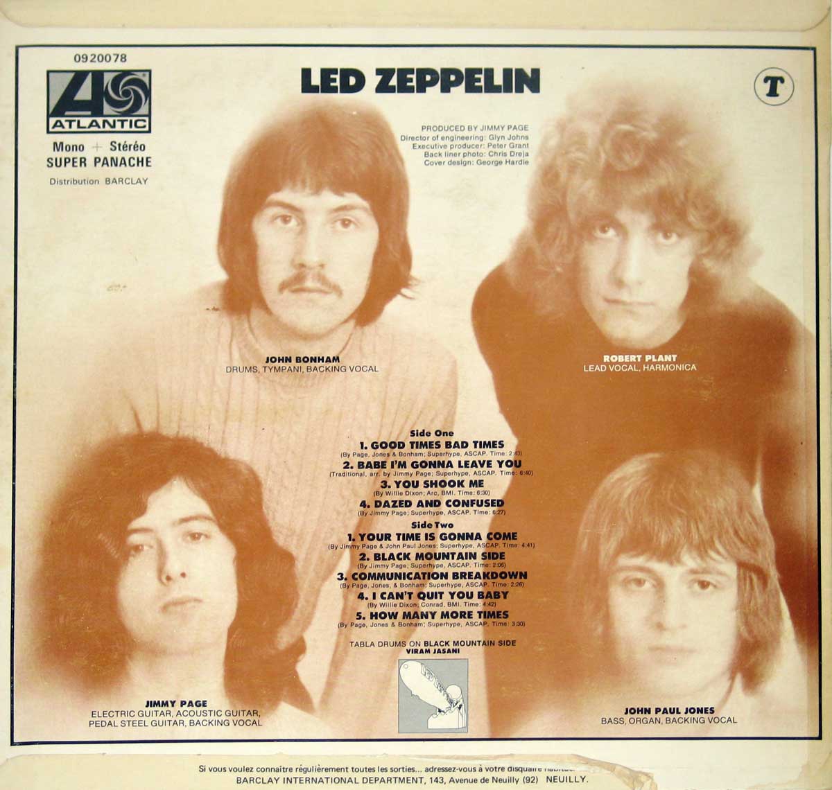 Back cover of the first French pressing of 'Led Zeppelin I', featuring sepia-toned portraits of John Bonham, Robert Plant, Jimmy Page, and John Paul Jones arranged in a square layout with their names and roles printed below. At the top left is the Atlantic Records logo, catalog number 0920078, mono/stereo indication, 'SUPER PANACHE' text, and 'Distribution BARCLAY' credit. At the top right, a circled 'T' symbol is printed. The center holds the track listing for both sides with writing credits and notes, including Viram Jasani on tabla. Production, engineering, design, and photography credits appear near the top center. Along the bottom edge is the Barclay International Department address in Neuilly. The flipback sleeve’s folded edges are visible along the top and sides.