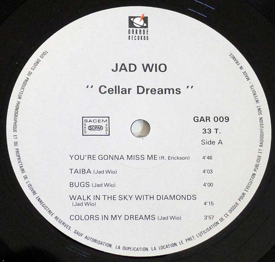 Close-up Photo of "JAD WIO Cellar Dreams Garage" Record Label 

