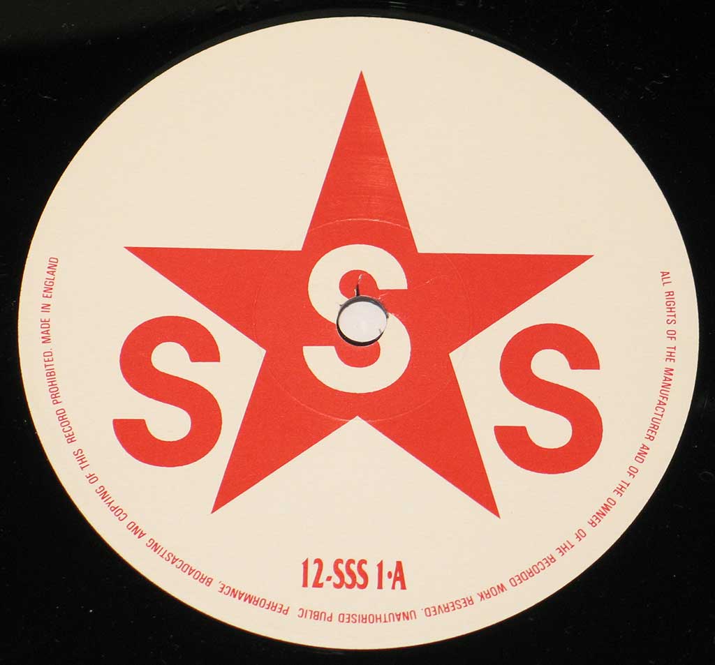 Close up of Side One record's label "Love Missile / Hack Attack" Record Label Details: 12-SSS 1 Vinyl Album