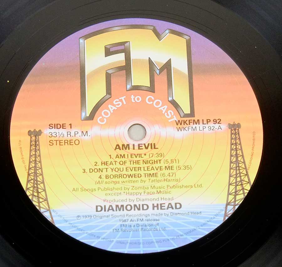 Close up of record's label DIAMOND HEAD - Am I Evil Genuine UK Release 12" Vinyl LP Album Side One