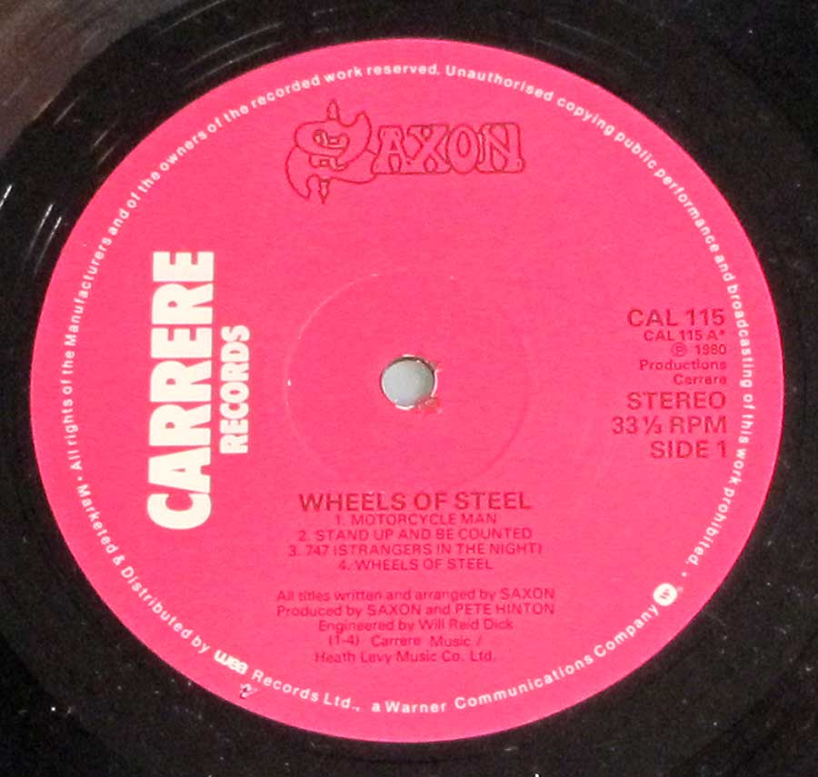 Close up of record's label SAXON - Wheels Of Steel ( UK Release ) Side One