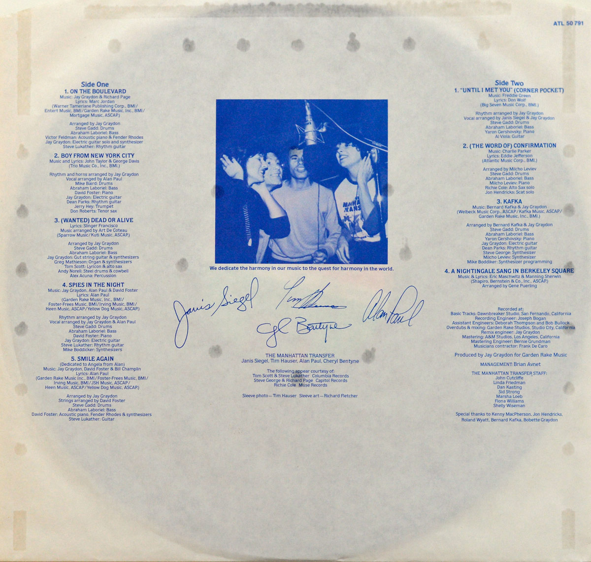 Custom inner sleeve of THE MANHATTAN TRANSFER - Mecca For Moderns. Features full track details, blue-tinted studio photo of the band recording vocals, and facsimile signatures.