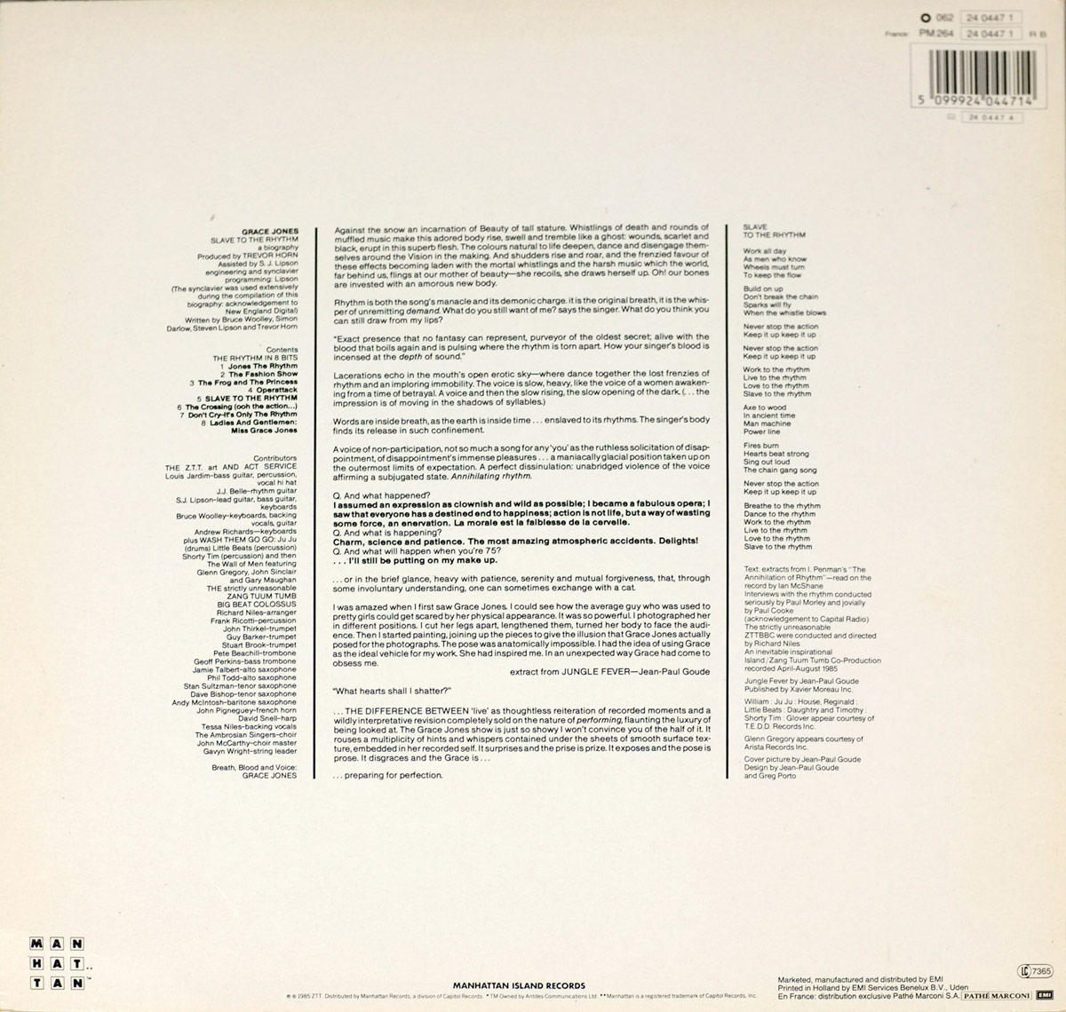 Back cover of the Grace Jones album Slave to the Rhythm. The design is laid out on a plain cream background with dense black text filling most of the center. On the left side is the album’s tracklist with song titles and credits in a narrow column. Production details follow beneath, naming producer Trevor Horn, assistant producer S.J. Lipson, engineers, and contributing musicians. The center section presents a block of liner notes and artistic text, including Jean-Paul Goude’s extract from Jungle Fever, arranged in justified paragraphs. To the right is a printed set of lyrics to the title track Slave to the Rhythm, formatted in poem-like lines. At the bottom edge are credits for marketing, distribution, and label information, including Manhattan Island Records and EMI. A barcode is printed at the top right corner. The overall style is minimalist yet text-heavy, emphasizing information and written art rather than imagery.