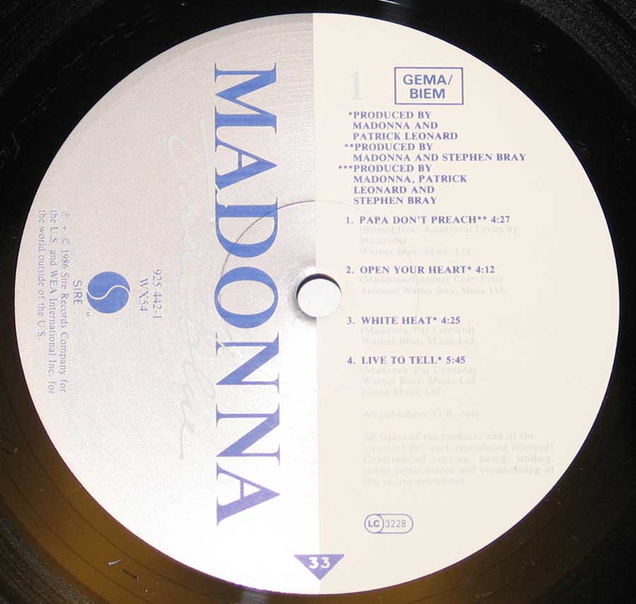 Close up of record's label Madonna - True Blue Side One