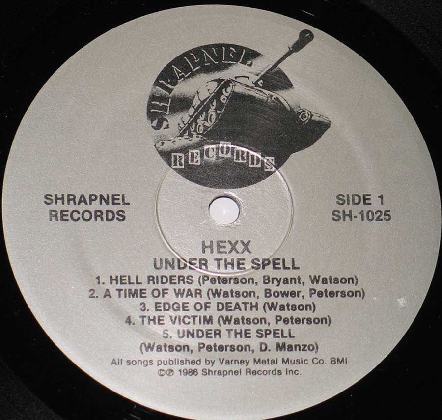 Close-up of Sharpnel record label for "Under The Spell" by "HEXX"