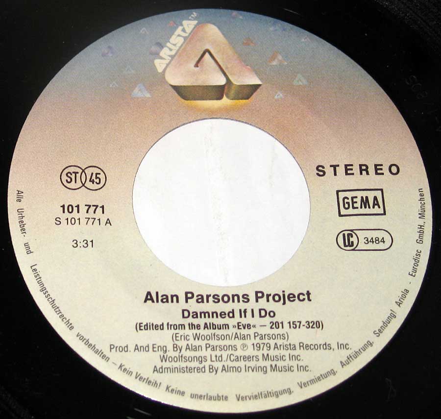 Close up of record's label ALAN PARSONS PROJECT Damned If I Do / You Lie Down With Dogs Side One