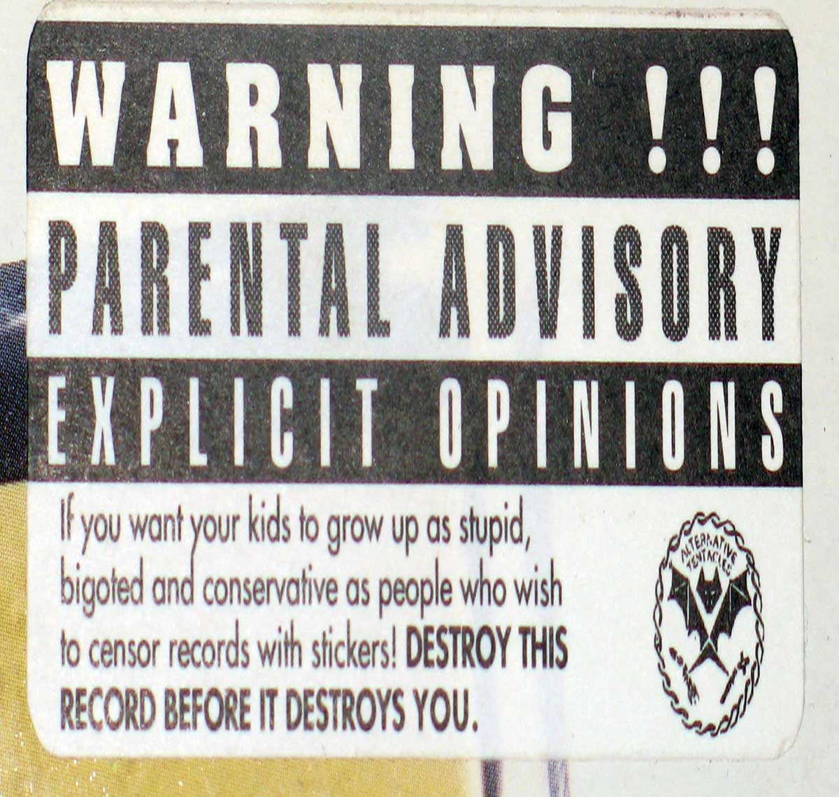 Close-up of "Parental Advisory with the warning: "Destroy This Record Before It Destroys You". 