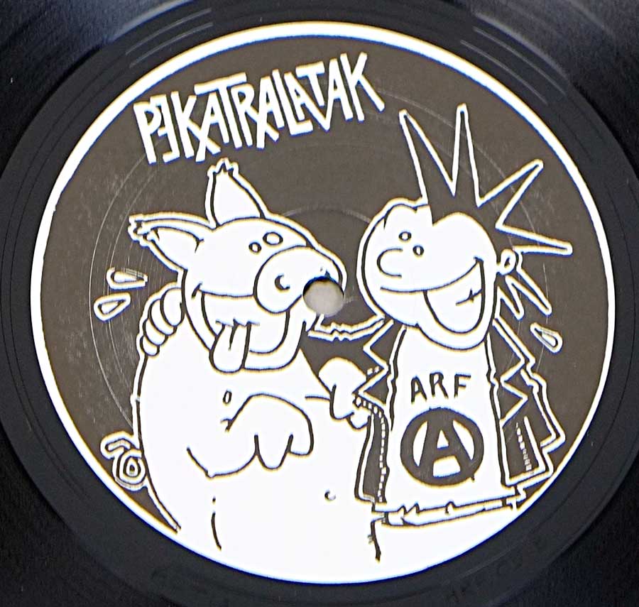 Close up of Side One record's label PEKATRALATAK - Mort Au PunK & URBAN BLIGHT - Revolte 12" LP VINYL ALBUM