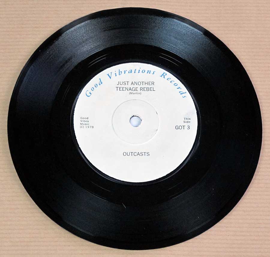 Photo of Side One of THE OUTCASTS - Justa Nother Teenage Rebel / Love Is For Sops Punk GOT 3 FOC 7" PS Single Vinyl 