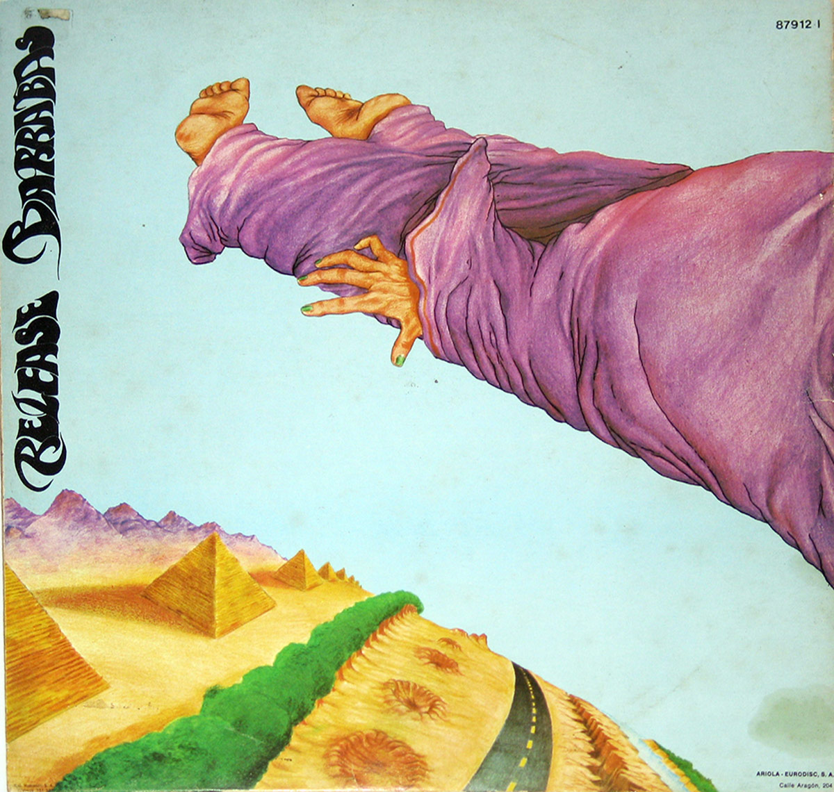 Back cover of '¡Soltad a Barrabás!', featuring a surreal illustration of a floating figure in a purple robe with outstretched hands and bare feet, above a desert landscape with pyramids and a winding road. The words 'Release Barrabás' appear in stylized black script along the left side.