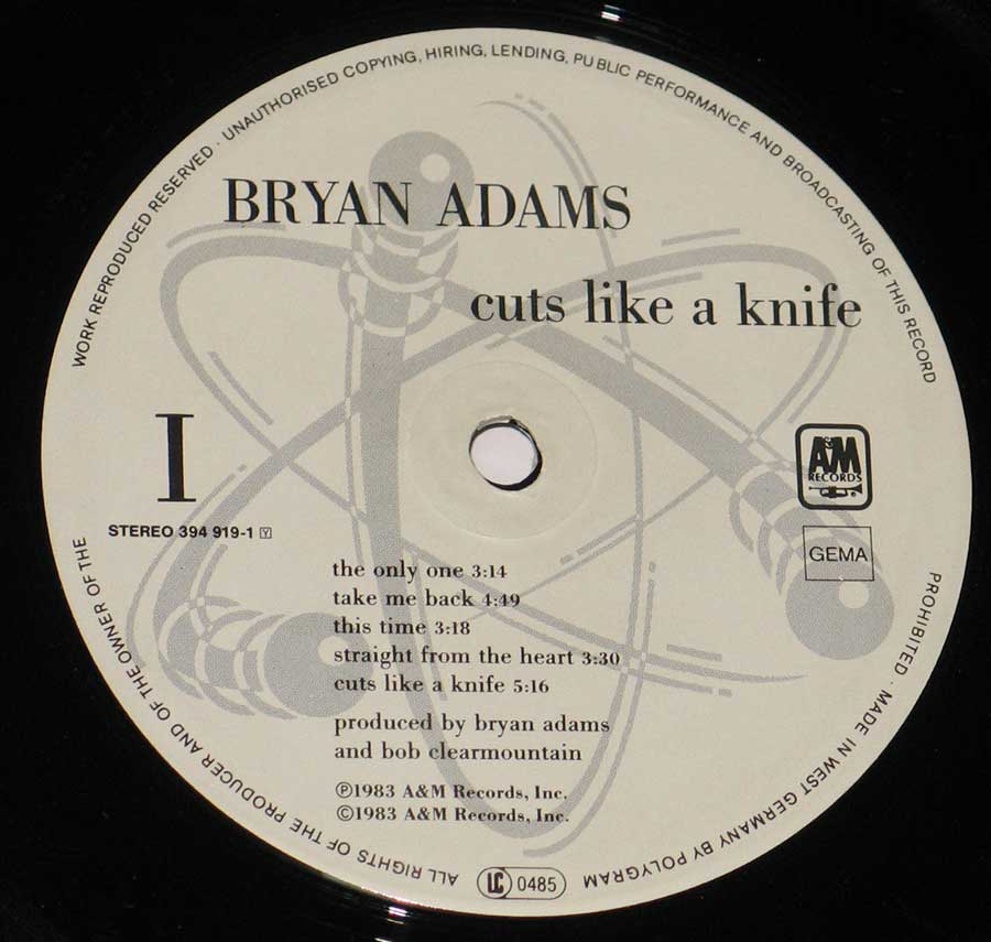 Close up of record's label BRYAN ADAMS - Cuts Like a Knife 12" Vinyl LP Album  Side One