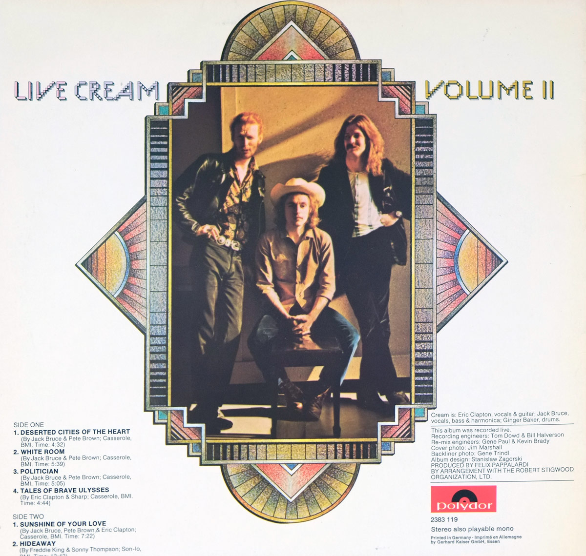 Back cover of 'Live Cream Volume II' by Cream, released by Polydor. The cover features a portrait of the three band members—Eric Clapton, Ginger Baker, and Jack Bruce—framed within an intricate Art Deco-inspired border with geometric patterns and stained-glass motifs. Clapton, on the left, wears a leather jacket and patterned shirt, while Bruce, on the right, dons a dark jacket with long hair flowing. Baker sits in the center wearing a cowboy hat and button-down shirt. The tracklist is displayed on the left side, listing iconic songs such as 'White Room' and 'Sunshine of Your Love.' The Polydor logo is at the bottom right.