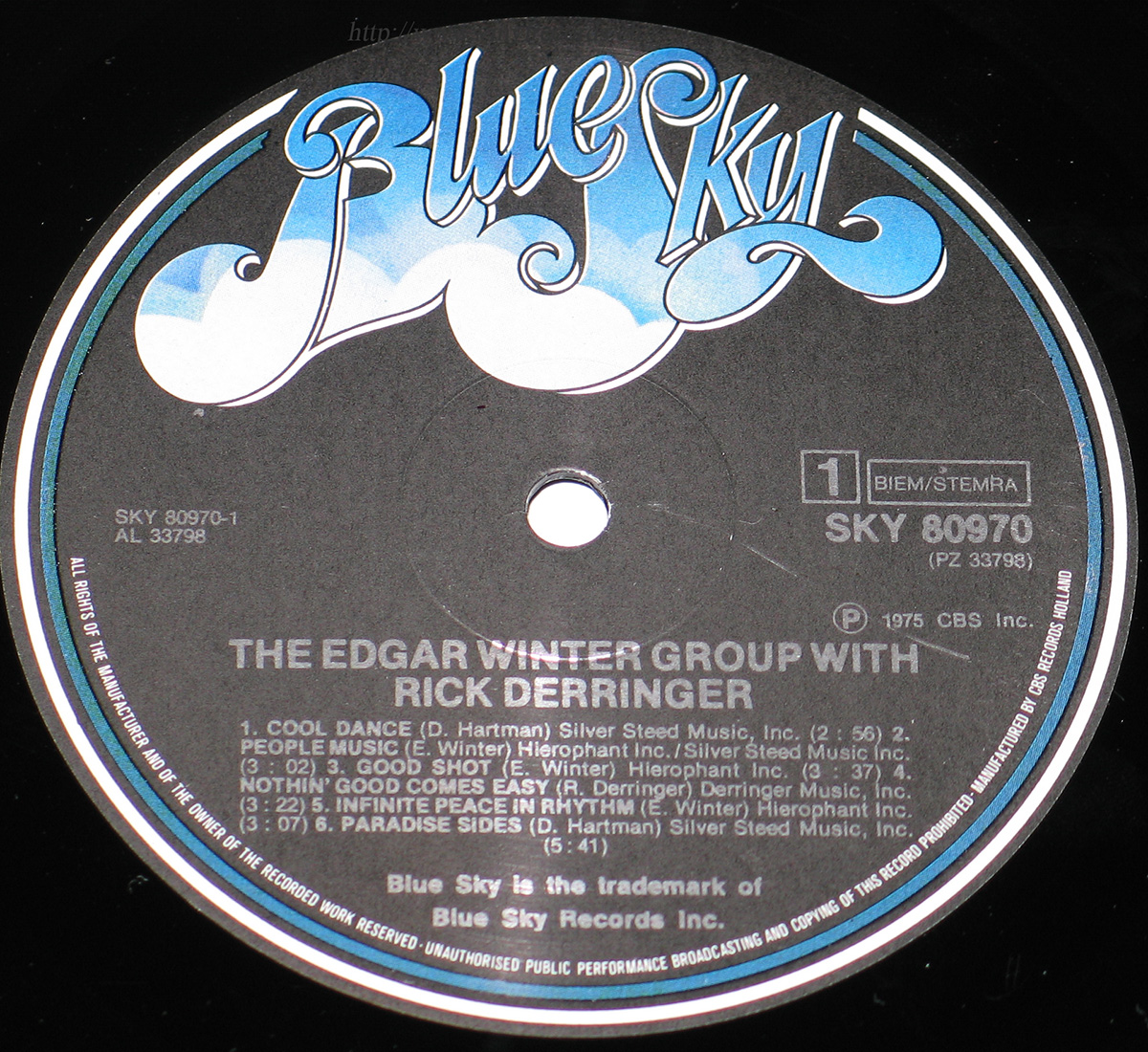 Close up of Side One record's label Edgar Winter with Rick Derringer