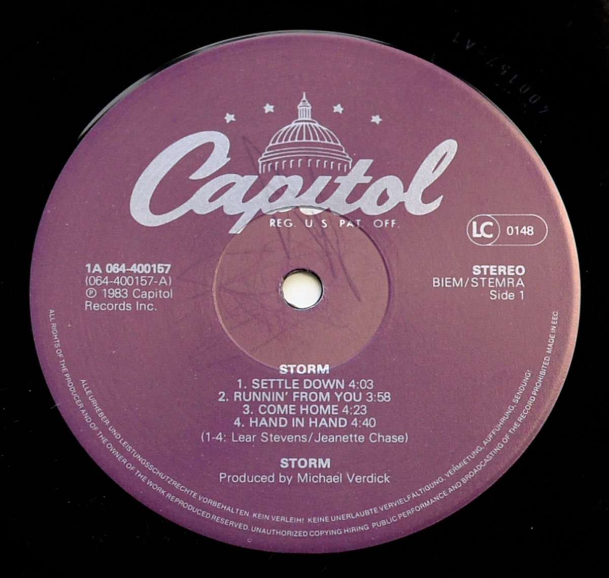 Label of STORM Self-Titled Side 1, 1983 Dutch pressing by Capitol Records with catalog number 1A 064-400157, lists 4 tracks and production by Michael Verdick.