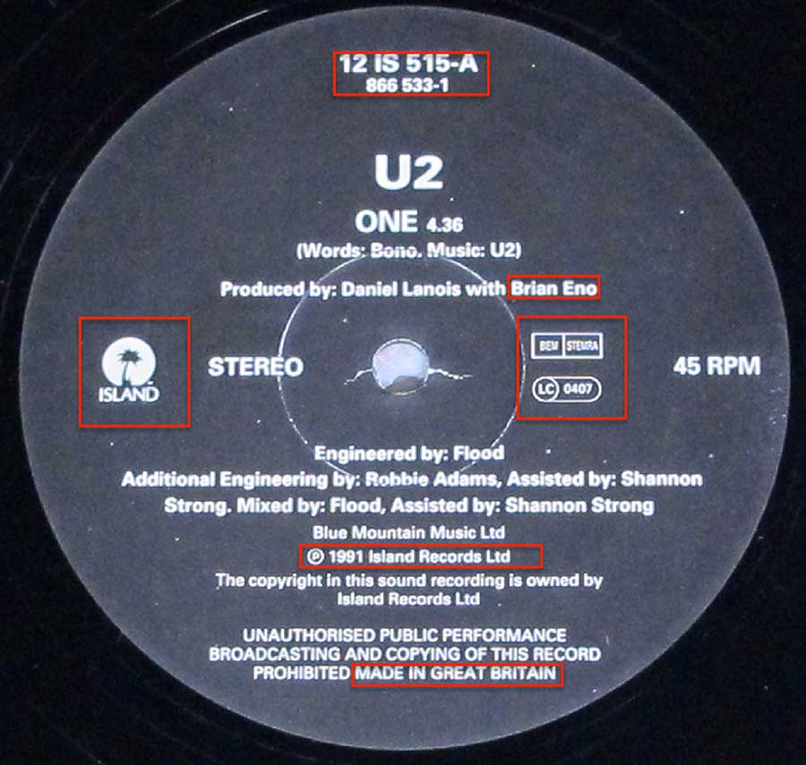 Close up of record's label U2 - One / Lady with the Spinning Head Side One