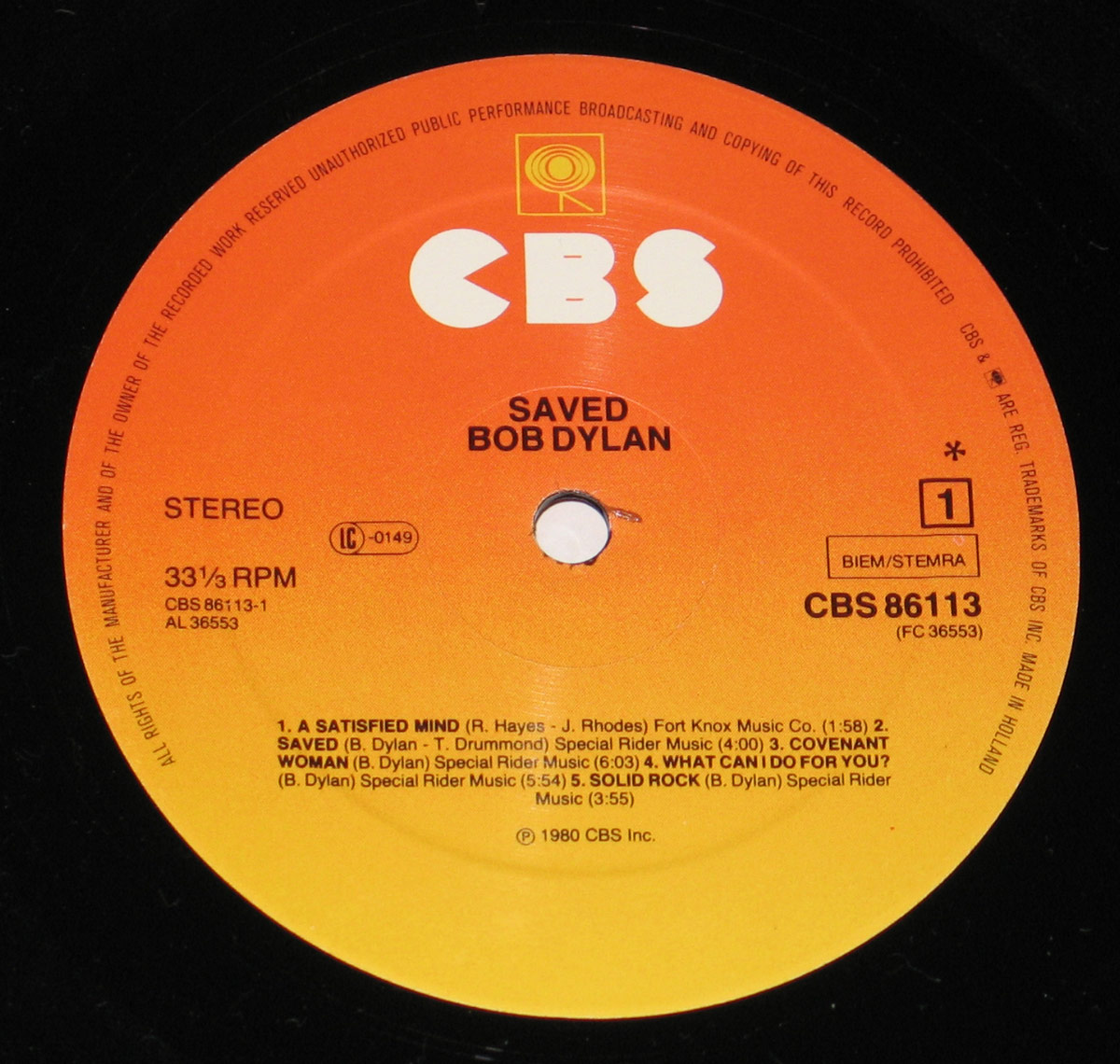 Bob Dylan Saved Netherlands 1980 vinyl record Side One label, orange-to-yellow CBS 86113 pressing with track titles and copyright text marked Made in Holland